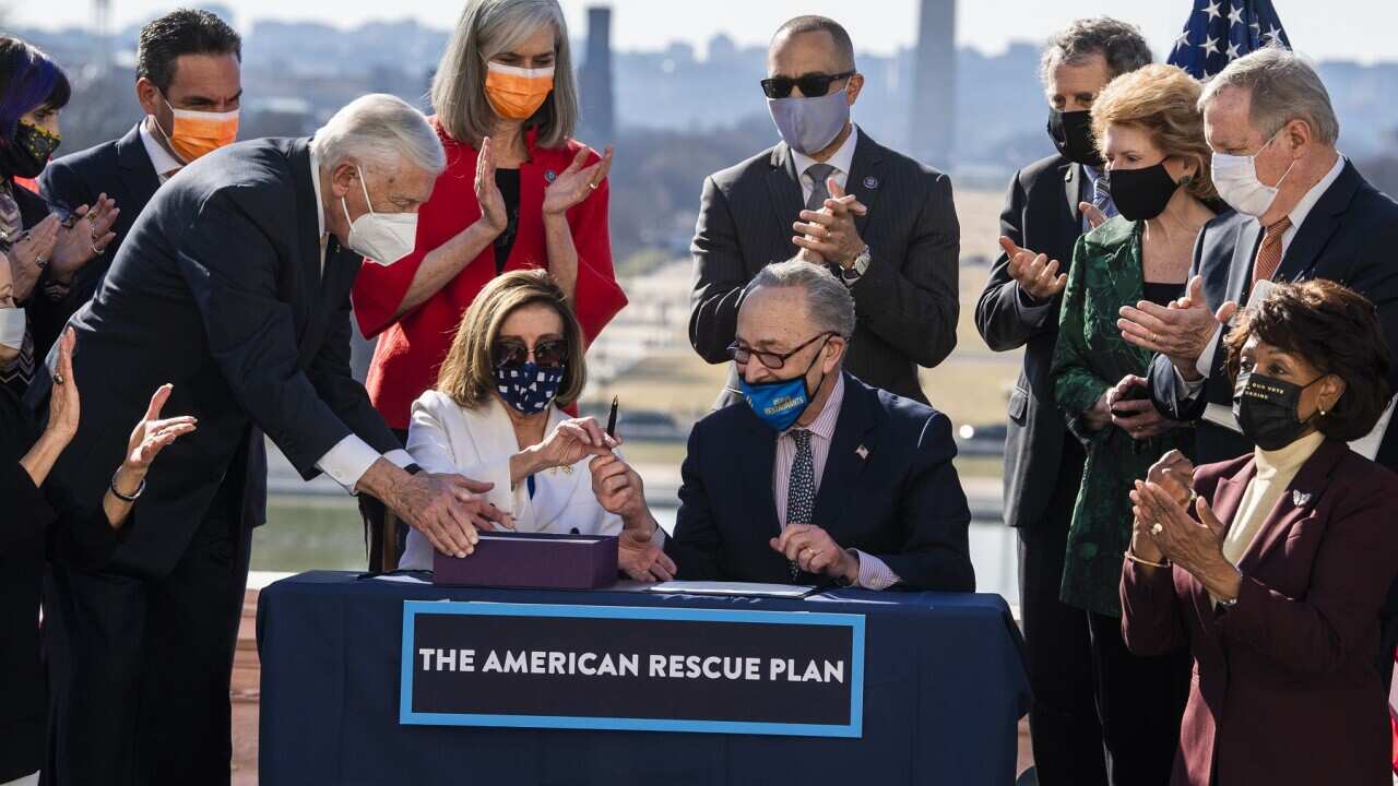 The American Rescue Plan Act is signed in Washington.