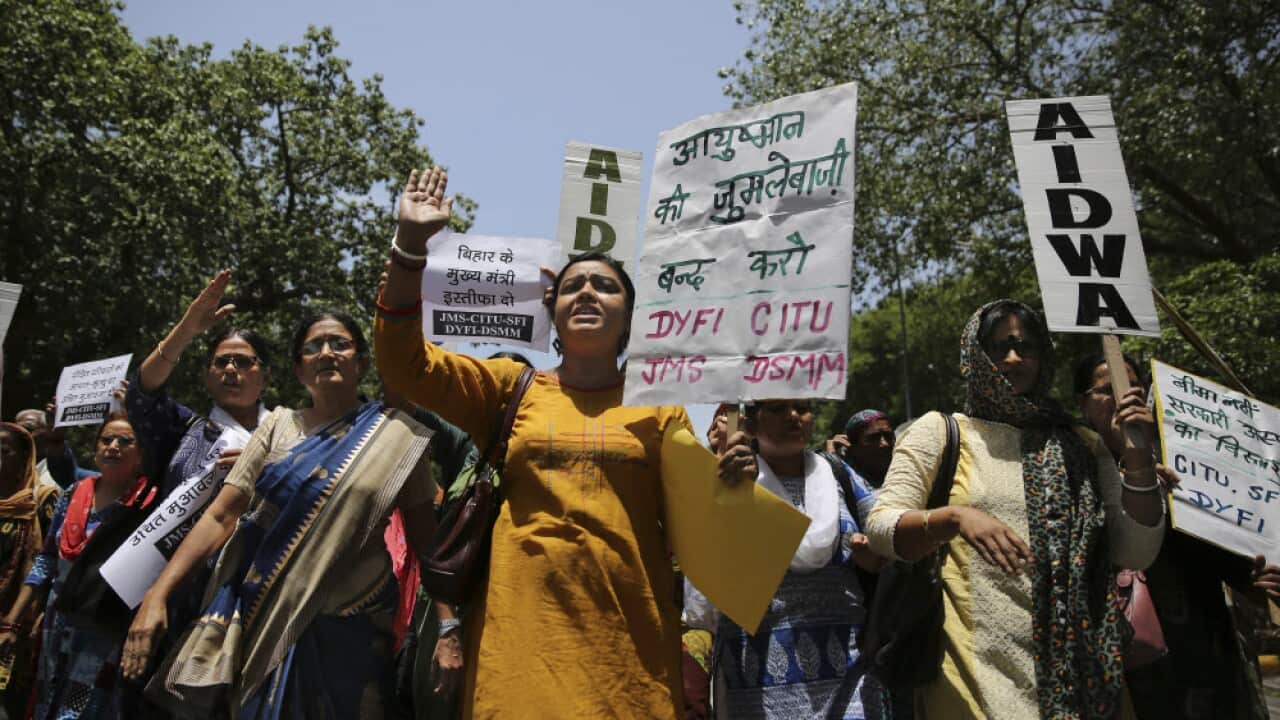 Activists shout slogans as they protest against deaths of more than 100 children due to Encephalitis in the Indian state of Bihar