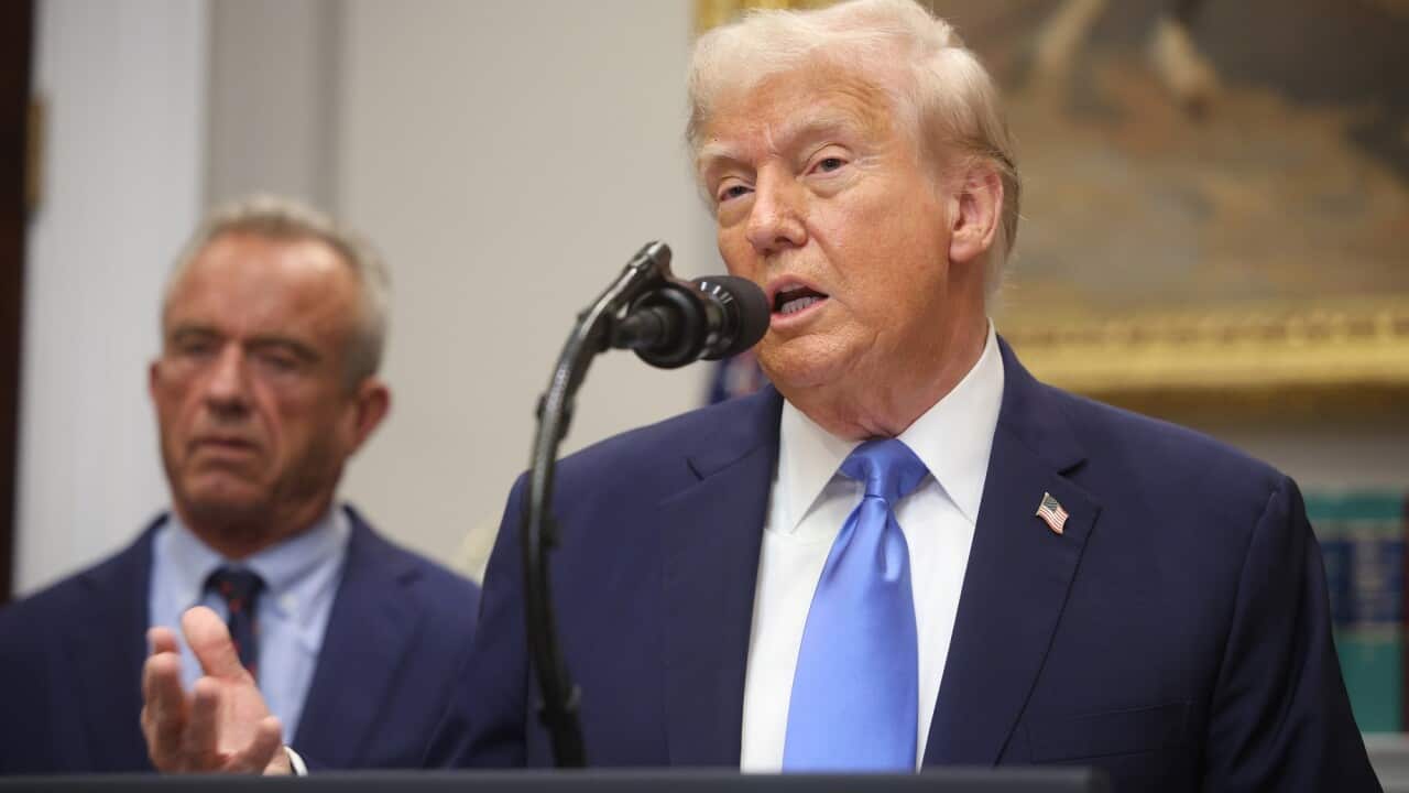 President Donald Trump in front of a microphone