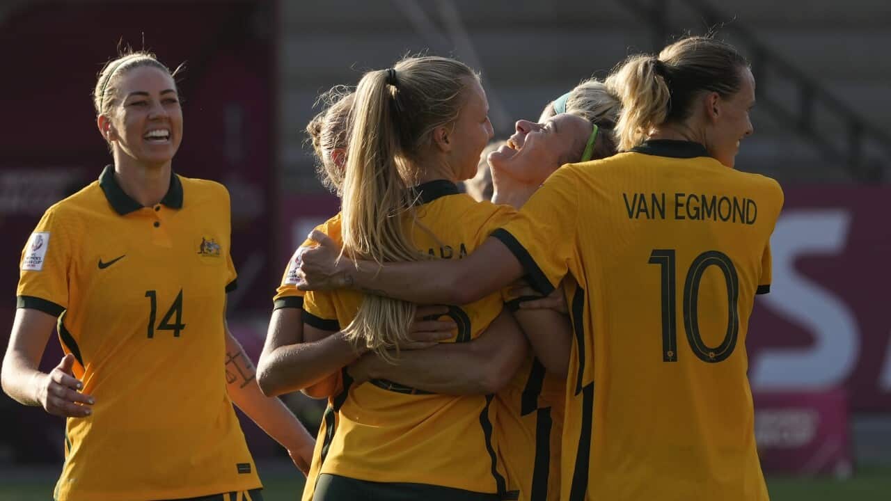 Australian players celebrate after scoring a goal during the AFC Women's Asian Cup 2022 match between Australia and Indonesia in Mumbai, India.