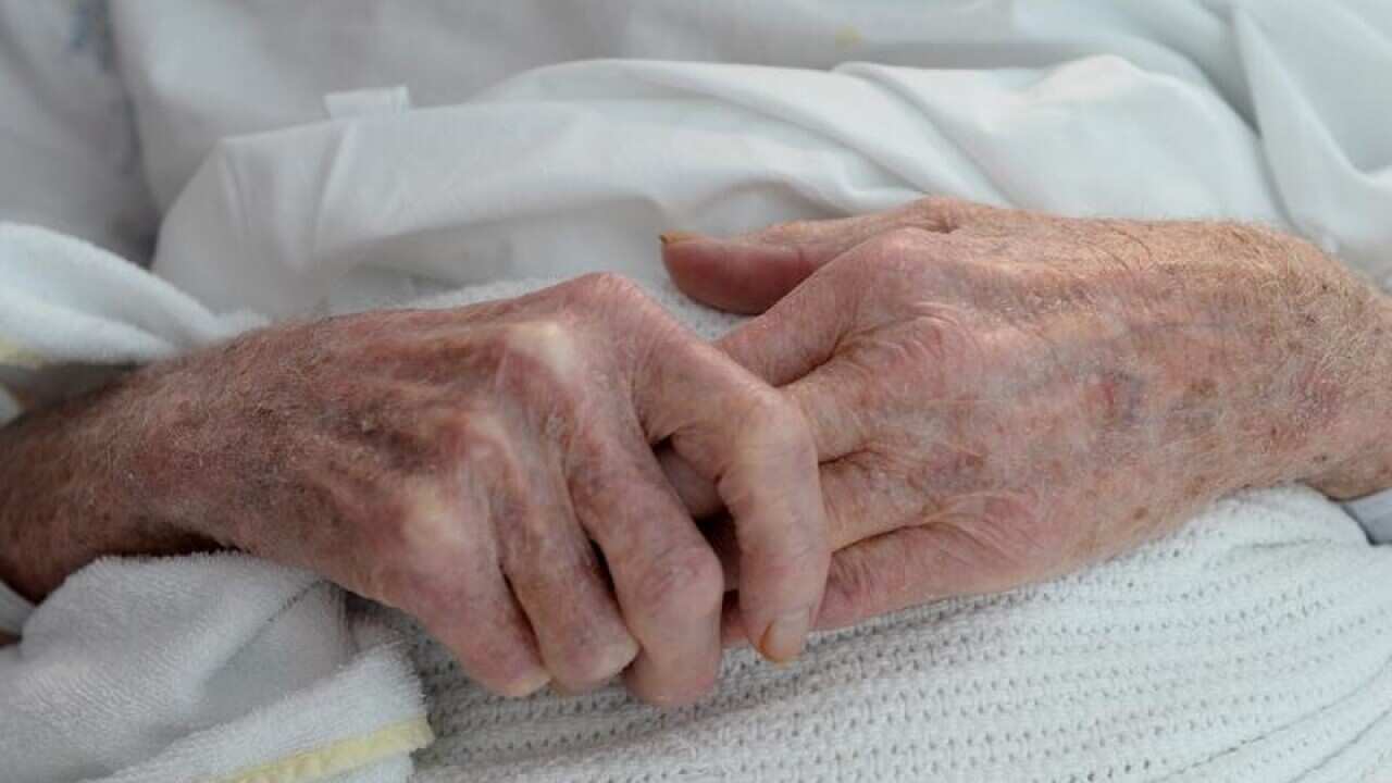 An elderly patient's hands