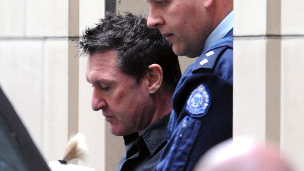 Steven James Hunter is lead away at the Supreme Court in Melbourne