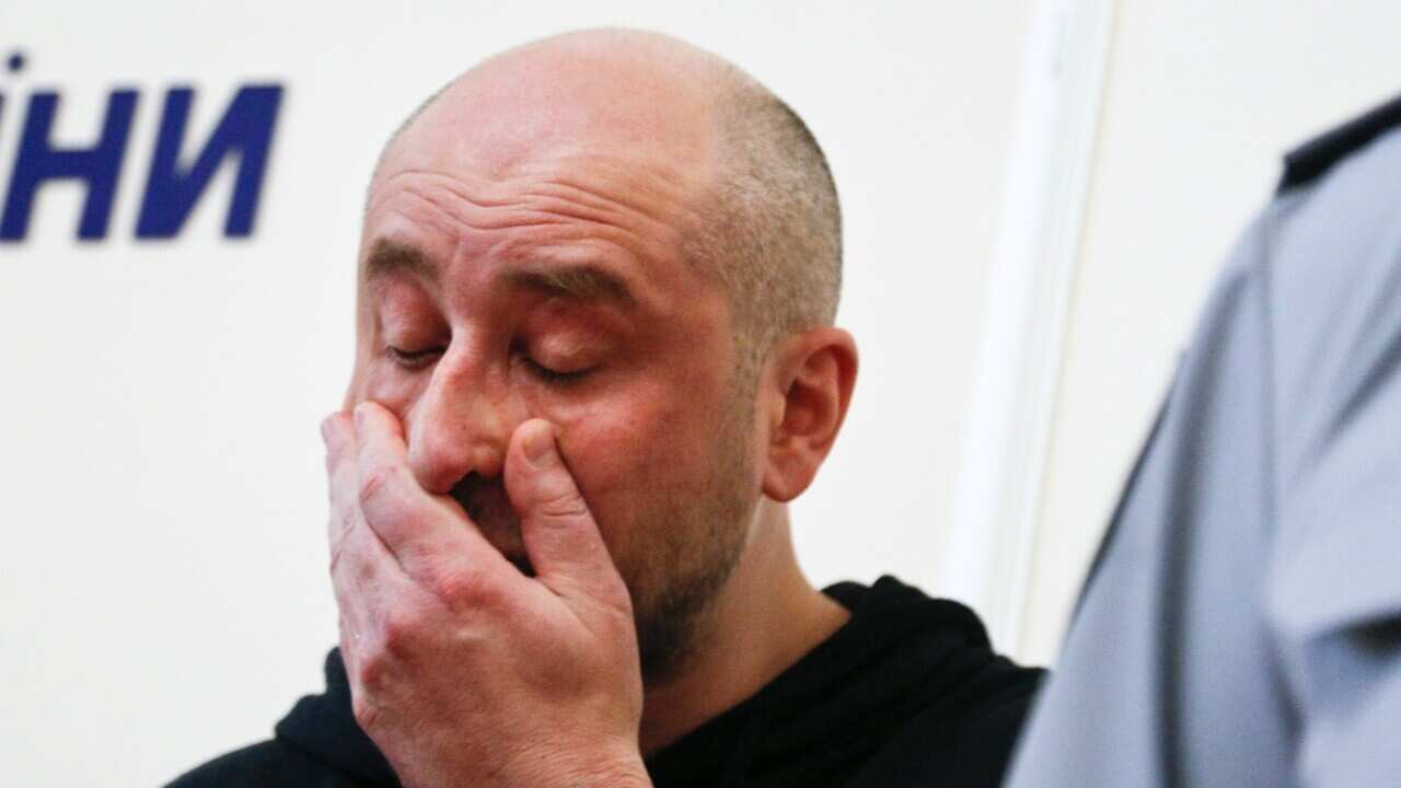 Russian journalist Arkady Babchenko, reacts during a news conference with Vasily Gritsak