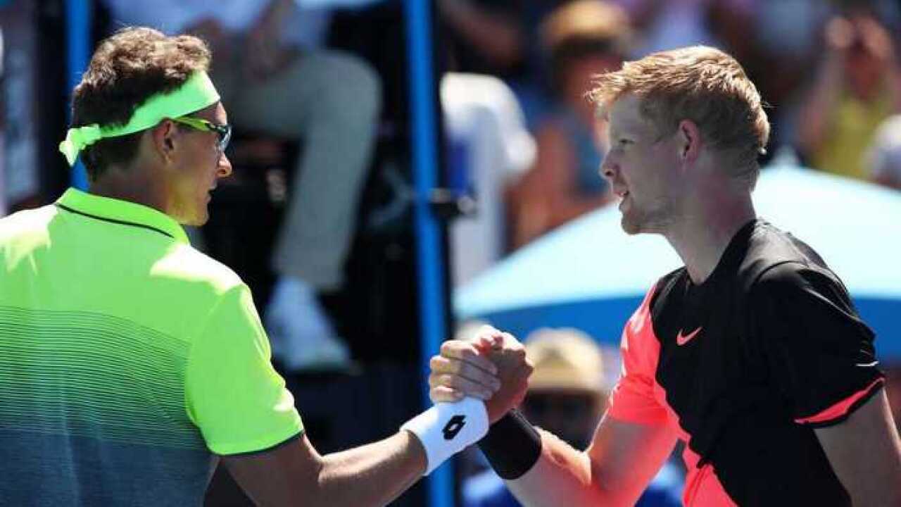 Denis Istomin and Kyle Edmund after the game