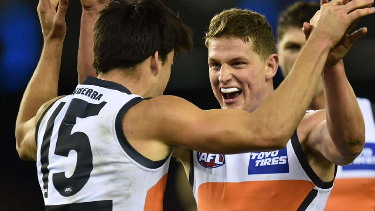 Matthew Kennedy (L) and Jacob Hopper of the Giants
