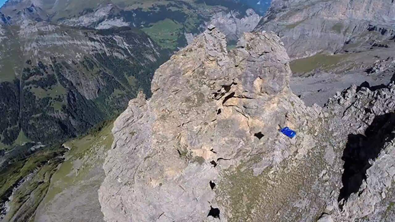 Daredevil Uli Emanuele straps on a wingsuit and GoPro before flying through a two-metre hole in a mountain. (Screenshot: YouTube)