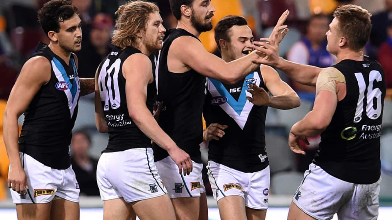 Port Adelaide Power players celebrates a goal