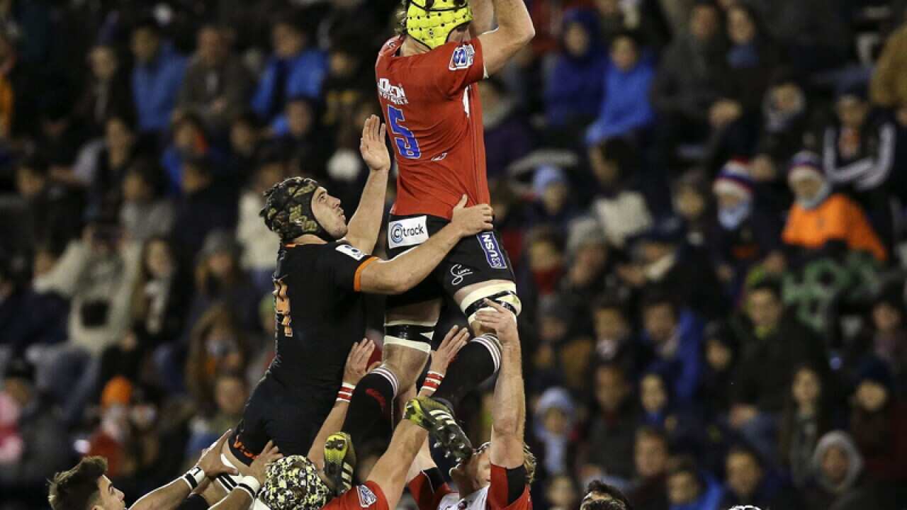The Jaguares (black) of Argentina in action against the Lions (red)