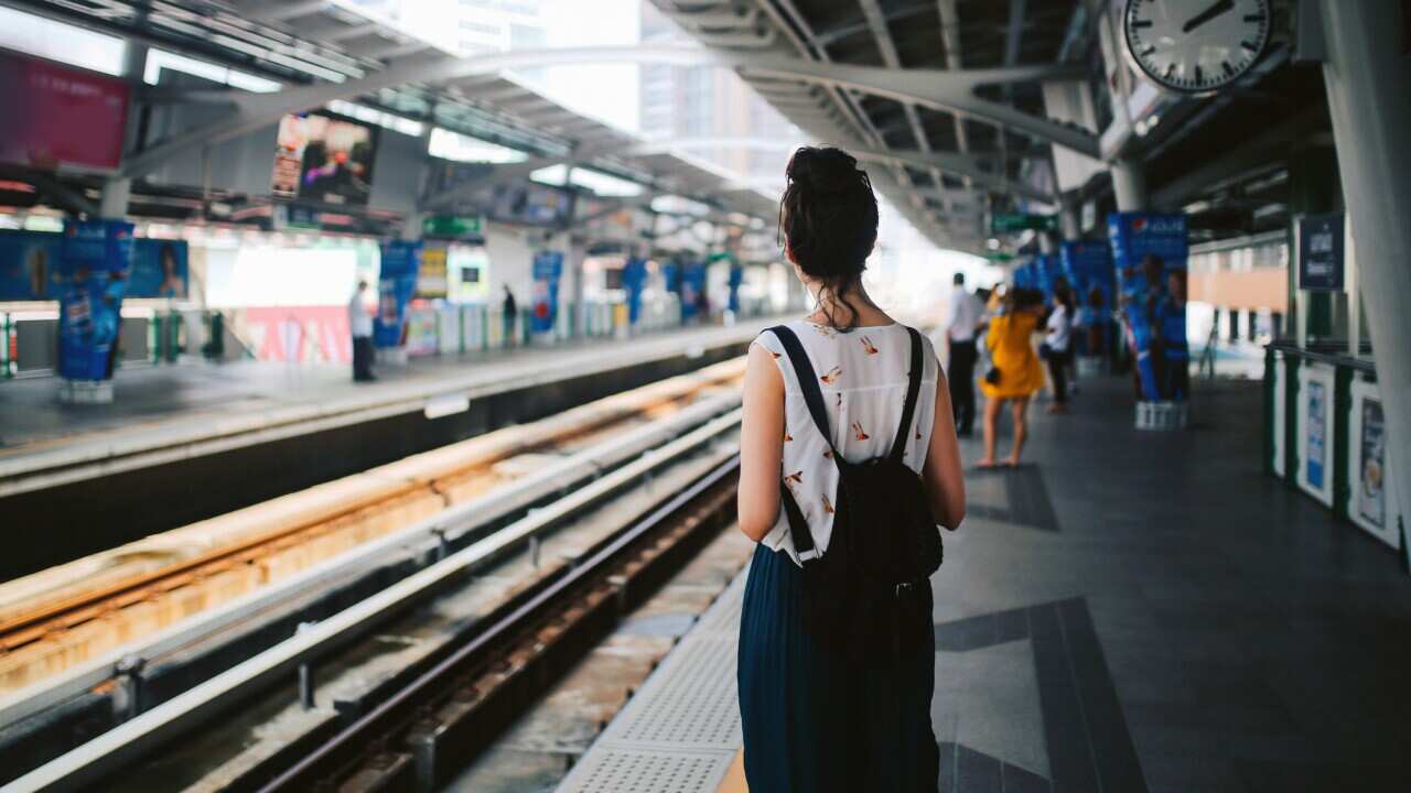 Tourist woman waiting for metro in Bangkok
