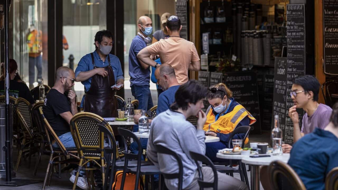 People dine outdoors and indoors in Degraves Street in Melbourne, 22 October.