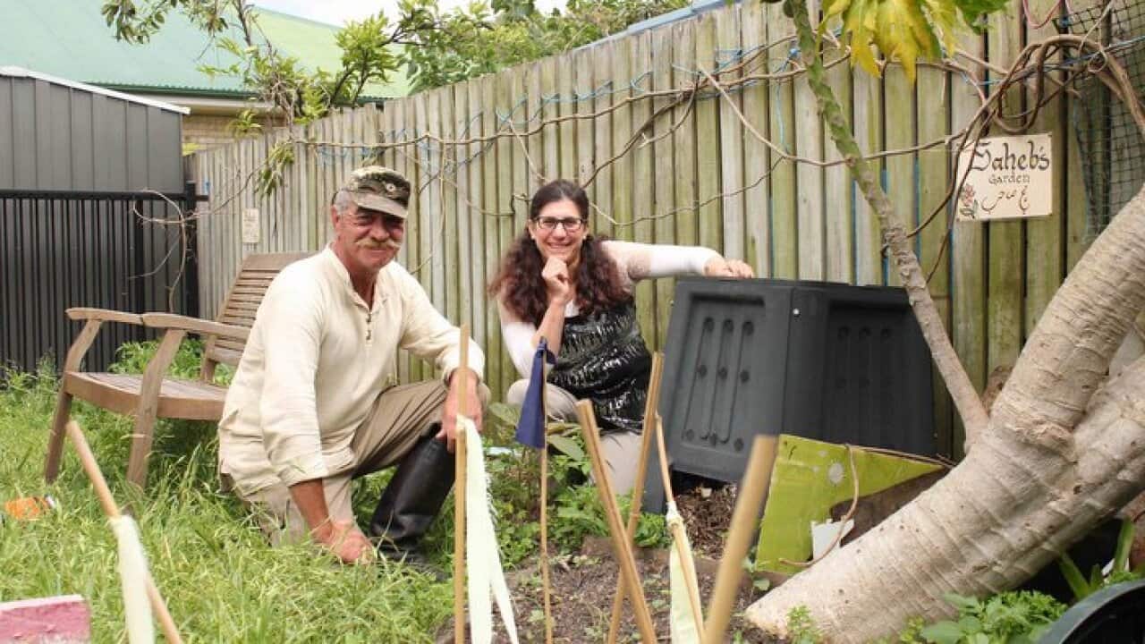 Peter and Saheb in the community garden