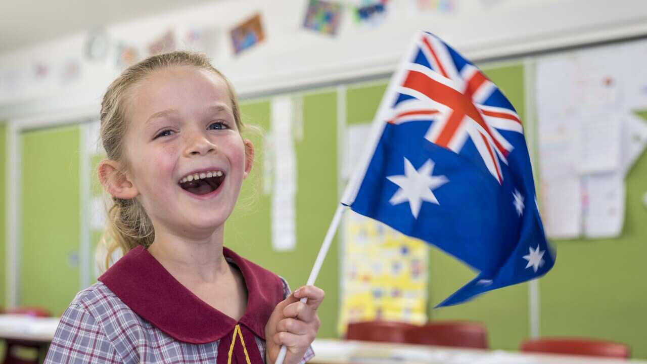 Australian Flag Waving by Primary School Student for Australia Day