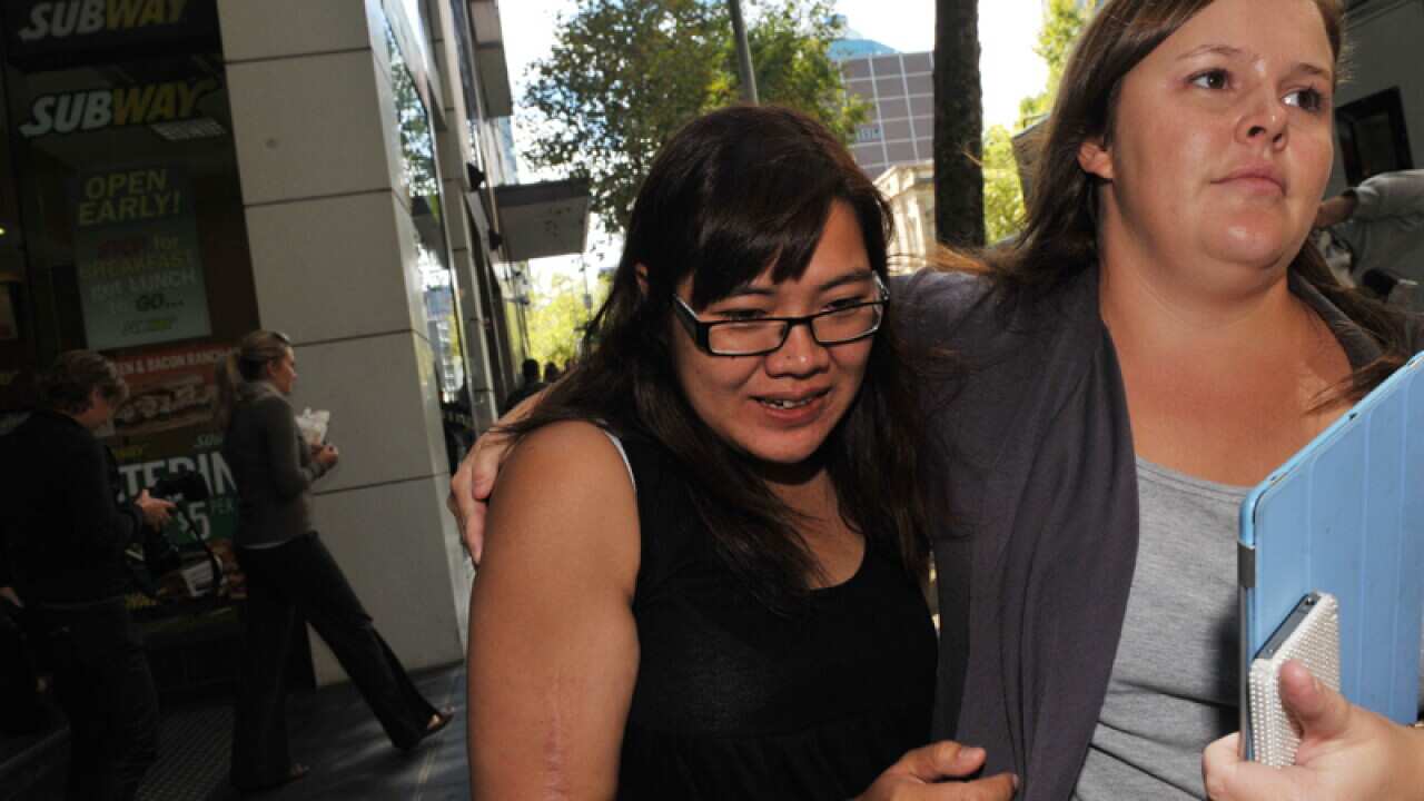 Ketapat Jenkins (left) leaves the Melbourne Magistrates Court