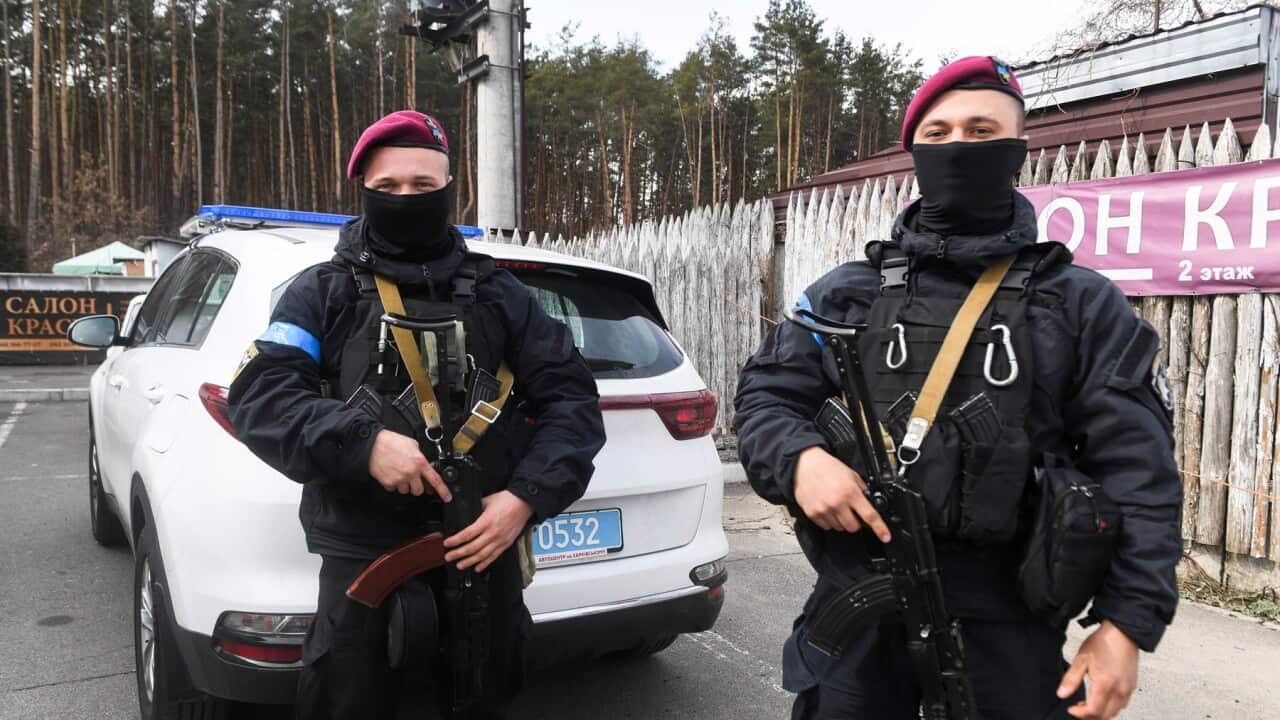 Ukrainian police patrol at a village near Irpin (AAP).jpg
