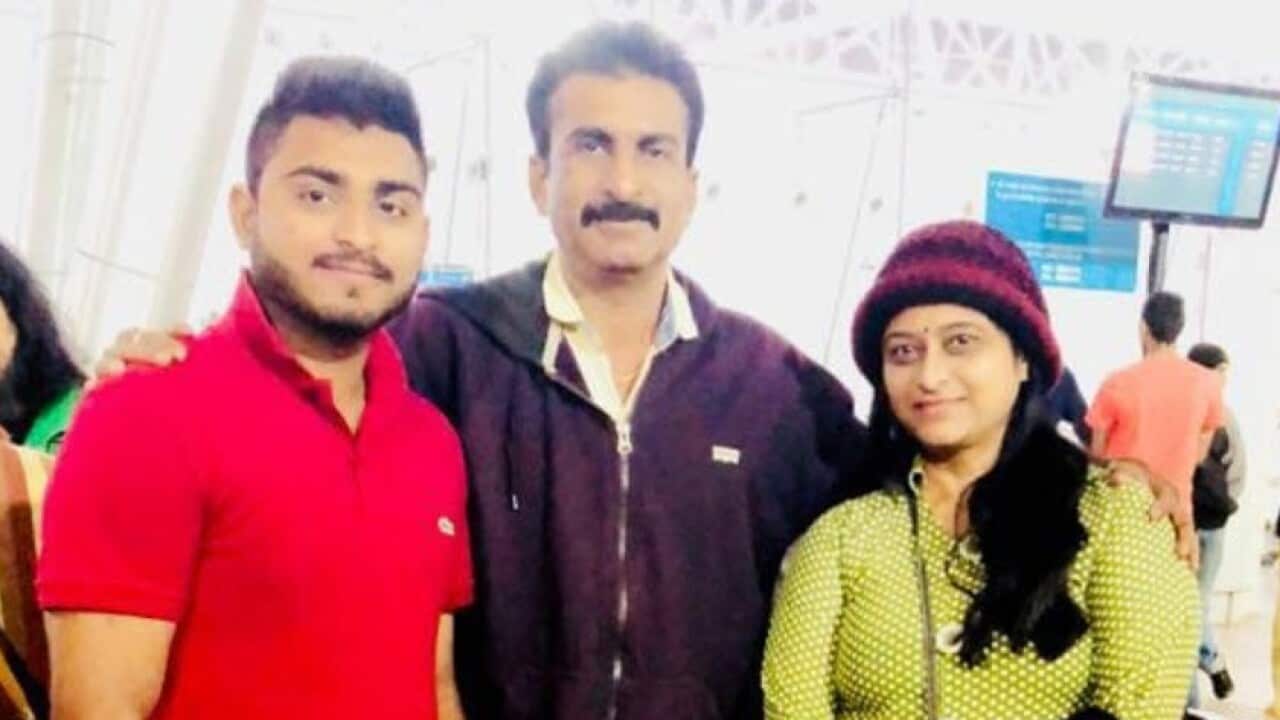 Maulin's last photo with his parent before he flew back to Australia.