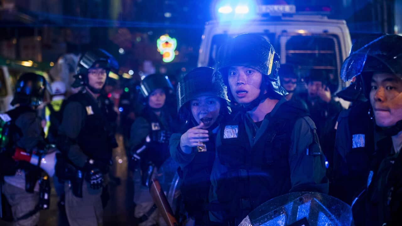 Riot police officers guard the streets during a protest in Hong Kong.