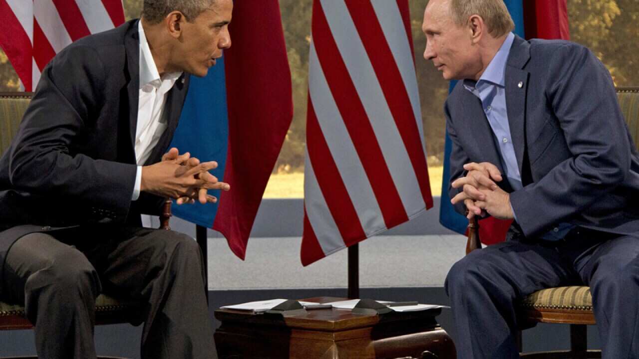President Barack Obama has lashed out at Russia's aggression in the Ukraine, while President Vladimir Putin hit back, accusing the US of interfering. (AAP)