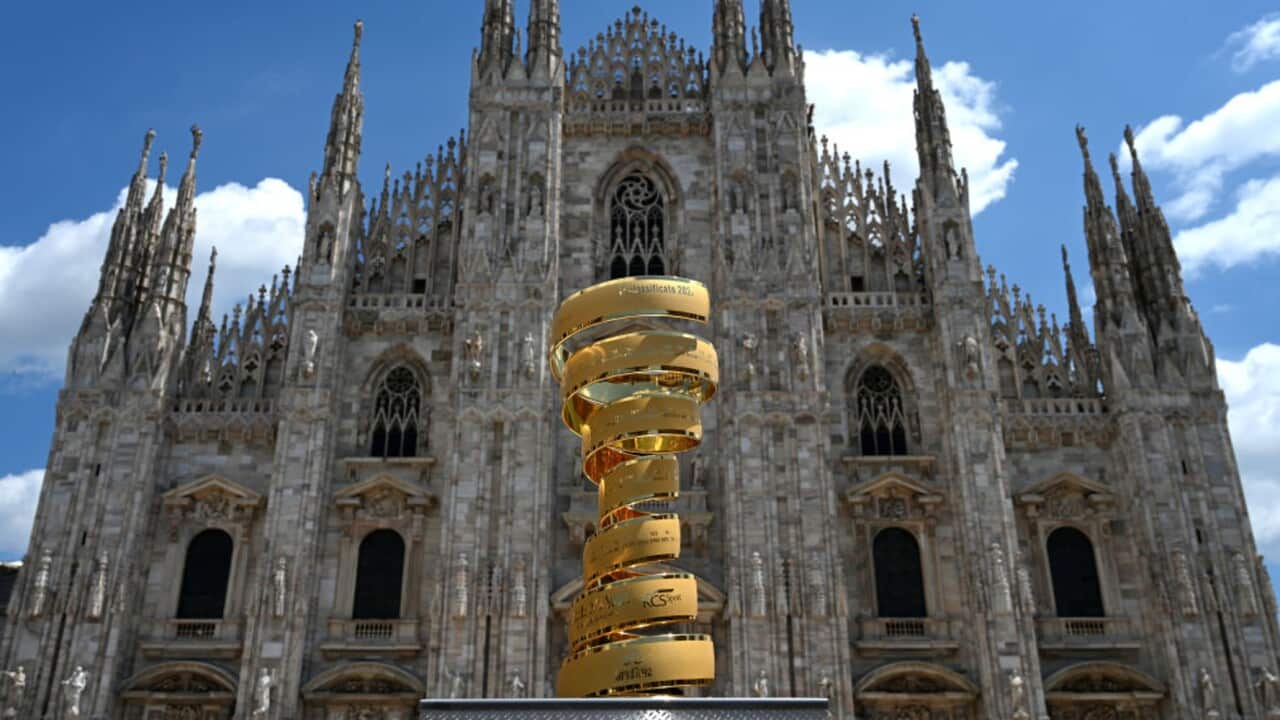 The Giro d'Italia trophy sits in front of the Duomo di Milano (Milan Cathedral)