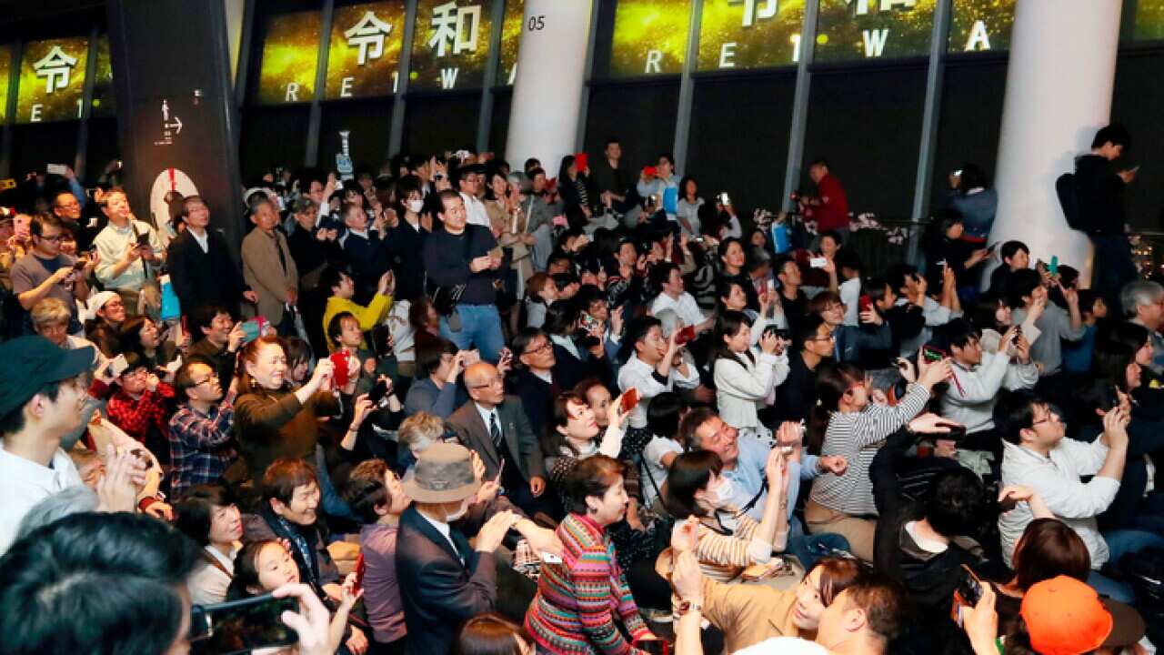 People celebrate the new era Reiwa in Tokyo as new Emperor Naruhito succeeds to the throne