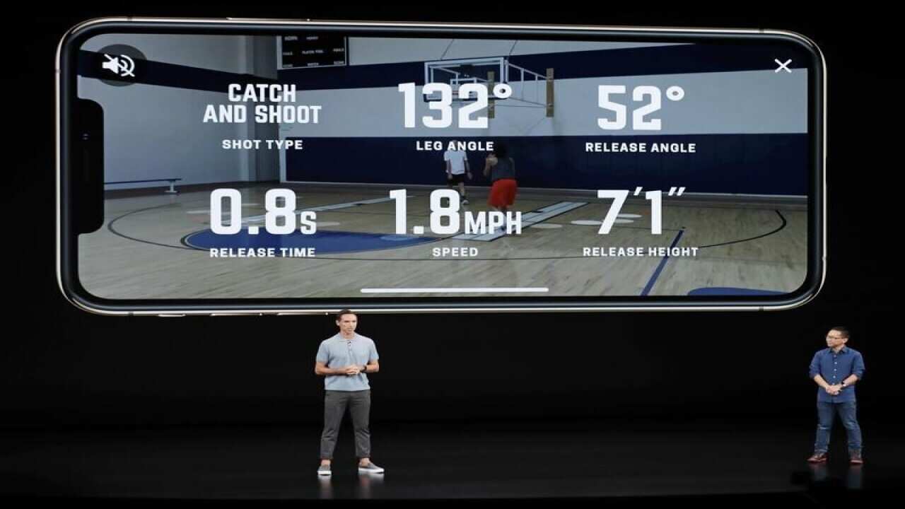 Presenters at the Apple event talk about the new phones