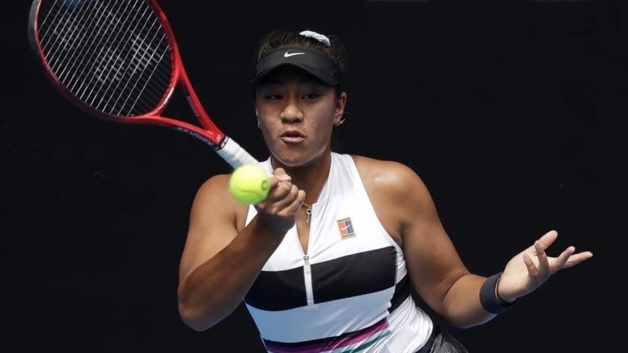 Destanee Aiava hits a forehand return.