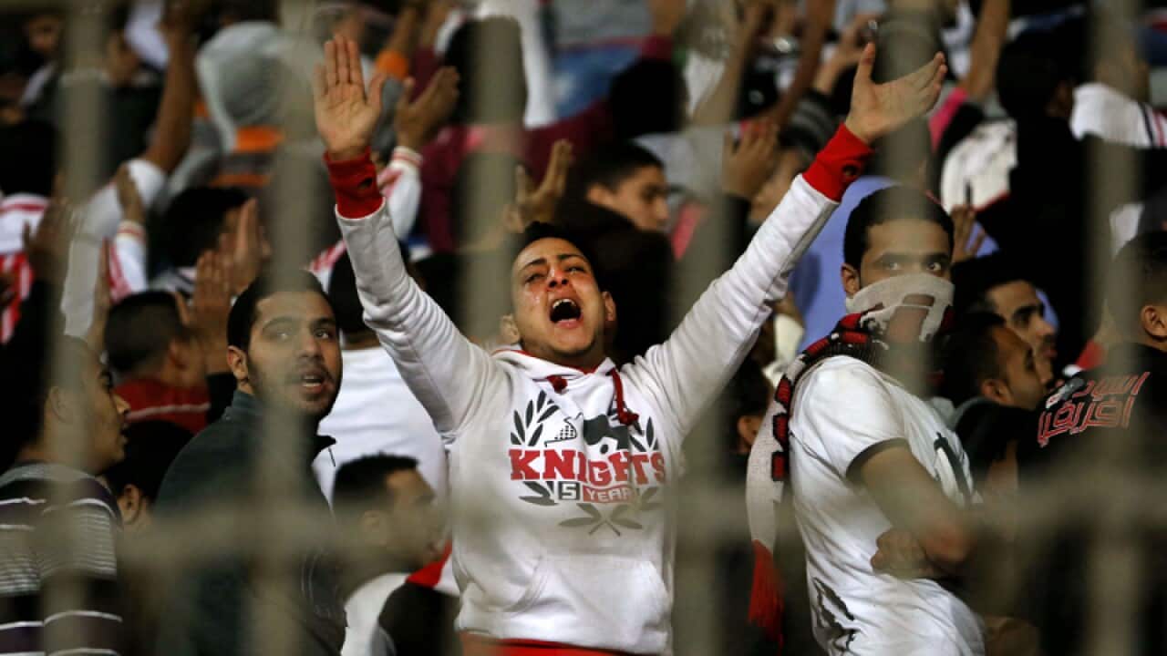 An Ultras White Knights soccer fan during a football match in Cairo