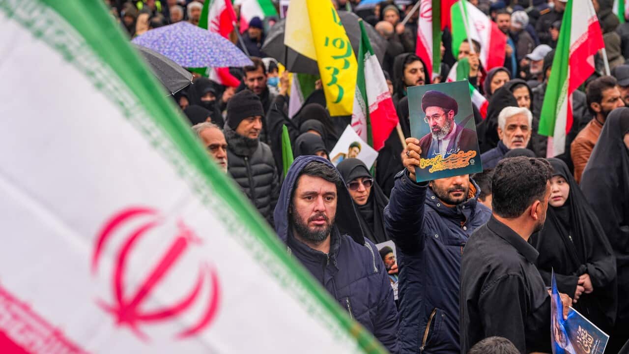 A man holds an image of Iran's newly appointed Supreme Leader, Ayatollah Mojtaba Khamenei, during an Al-Quds (Jerusalem) Day rally in support of Palestinians on the last Friday of the Muslim holy month of Ramadan in Tehran