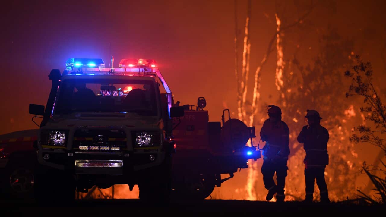 NSW Rural Fire Service crews protect properties on Waratah Road and Kelyknack Road as the Three Mile fire approaches Mangrove Mountain north of Sydney.