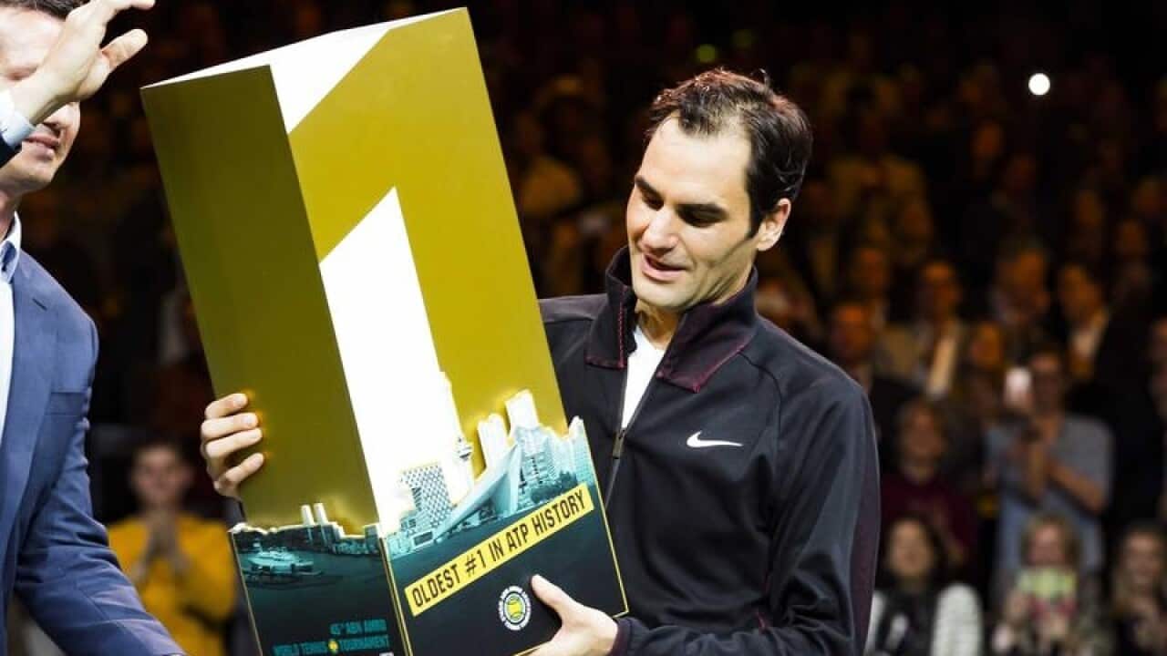 Swiss tennis player Roger Federer received a No.1 trophy