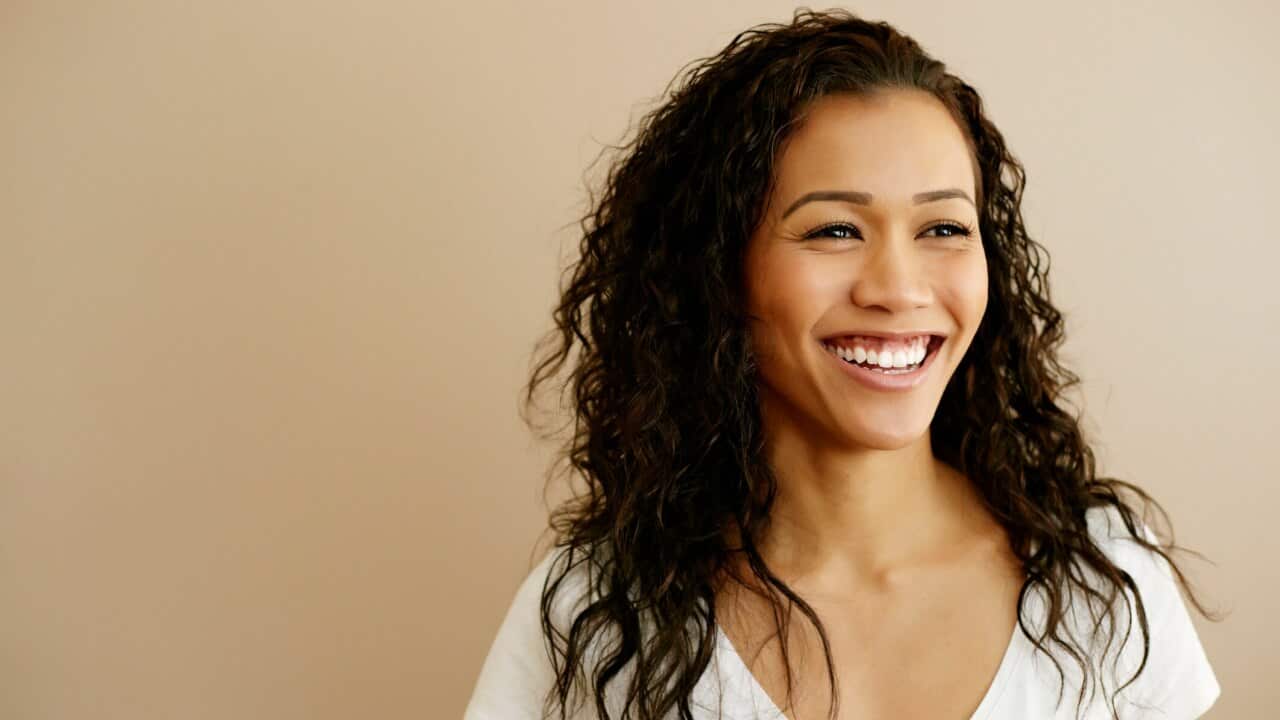 Portrait of smiling Mixed Race woman