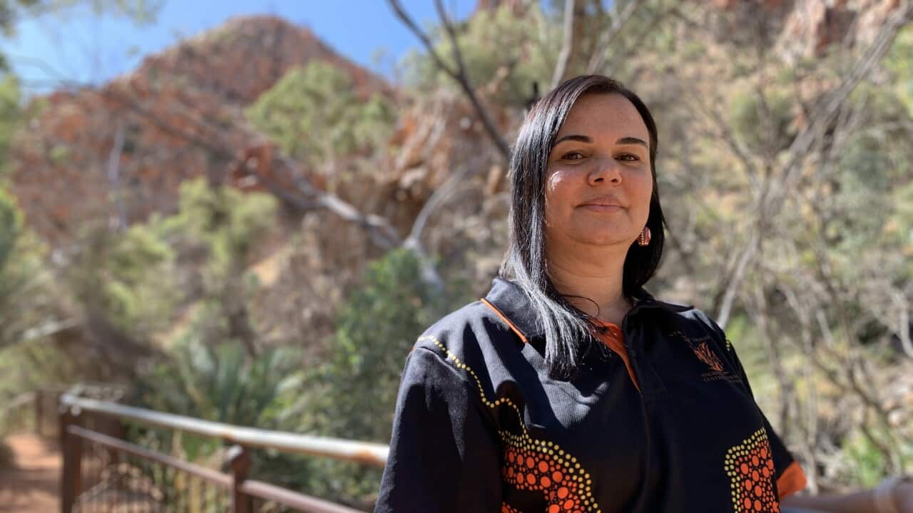 Nova Pomare stands at a railing at Standley Chasm