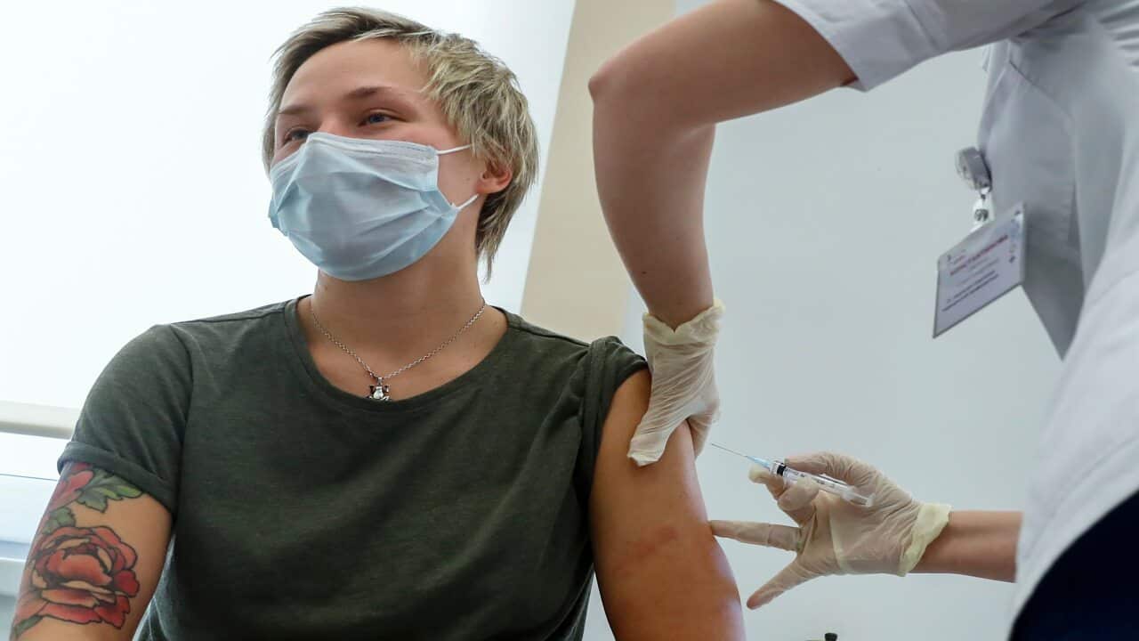 A Russian medical worker administers a shot of Russia's Sputnik V coronavirus vaccine in Moscow on 5 December, 2020.