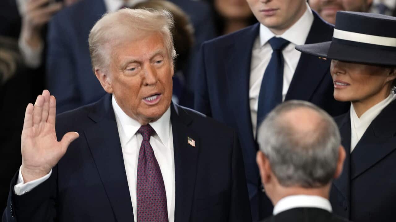 Donald Trump is sworn in as the 47th president of the United States by Chief Justice John Roberts as Melania Trump holds the Bible during the 60th Presidential Inauguration in the Rotunda of the U.S. Capitol in Washington, Monday, Jan. 20, 2025