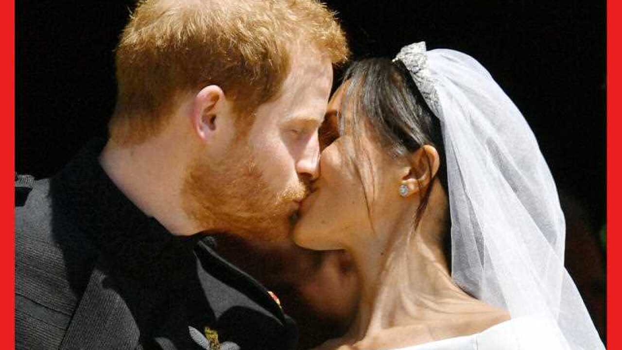 Prince Harry and Meghan Markle kiss on the steps of St George's Chapel in Windsor Castle after their wedding. AAP.