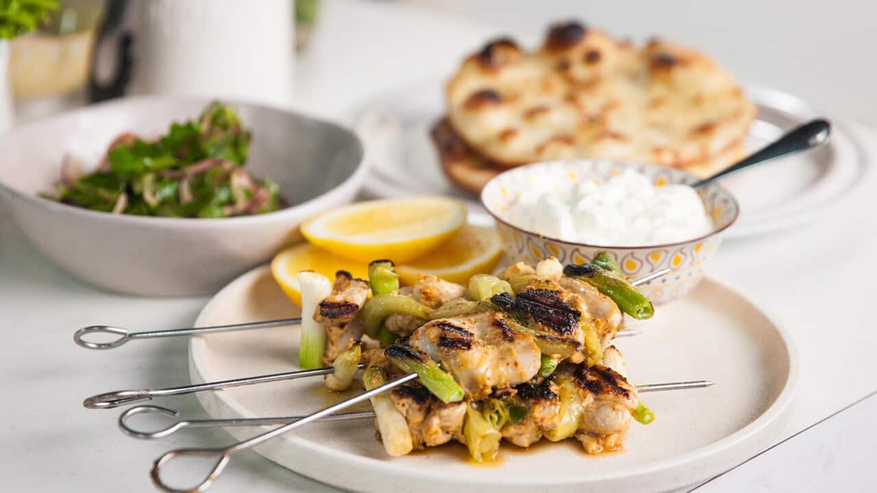 Chicken shawarma with puffed pita and pickled onion salad