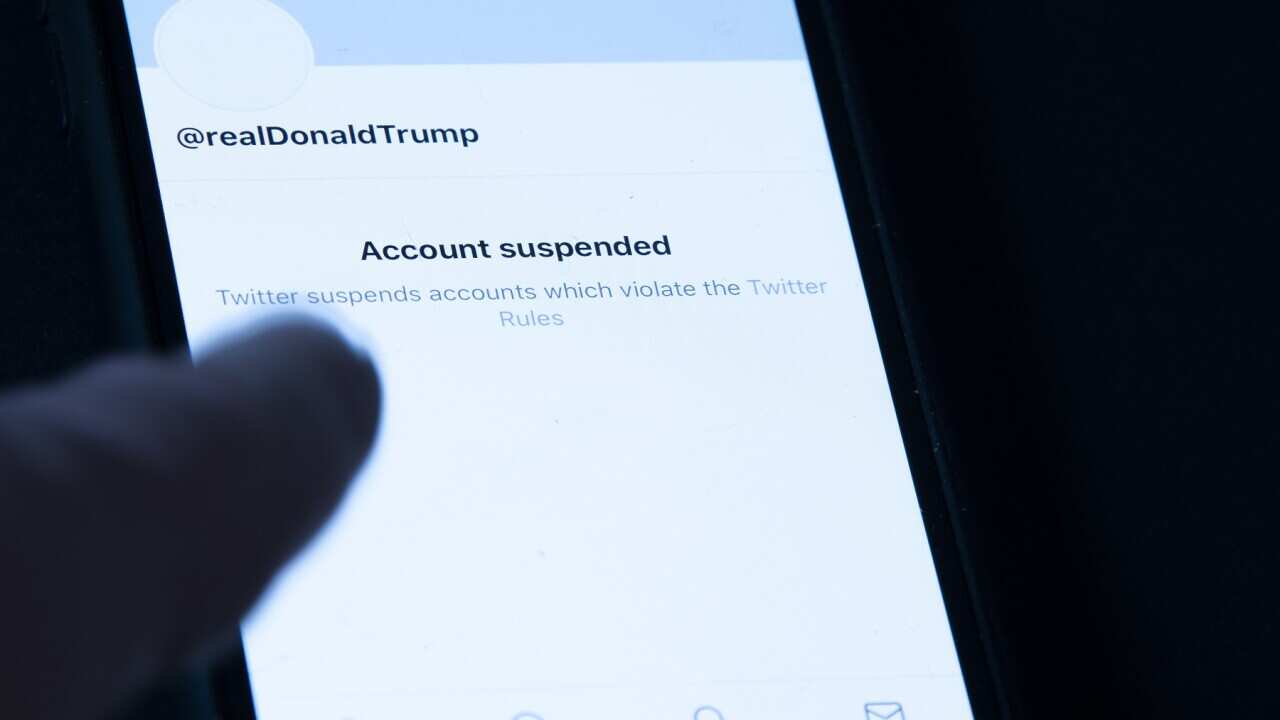 President Donald Trump's suspended Twitter account is seen on a mobile phone