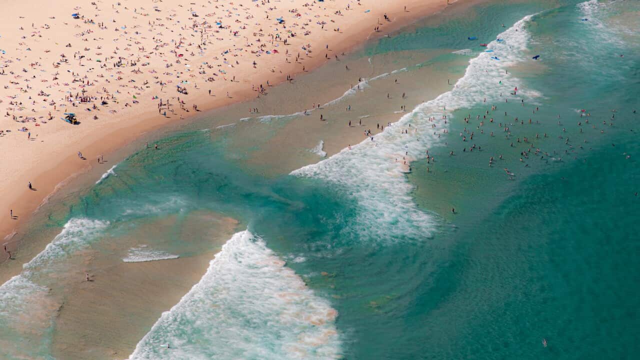 Bondi Beach water swirling rip current looking down helicopter view