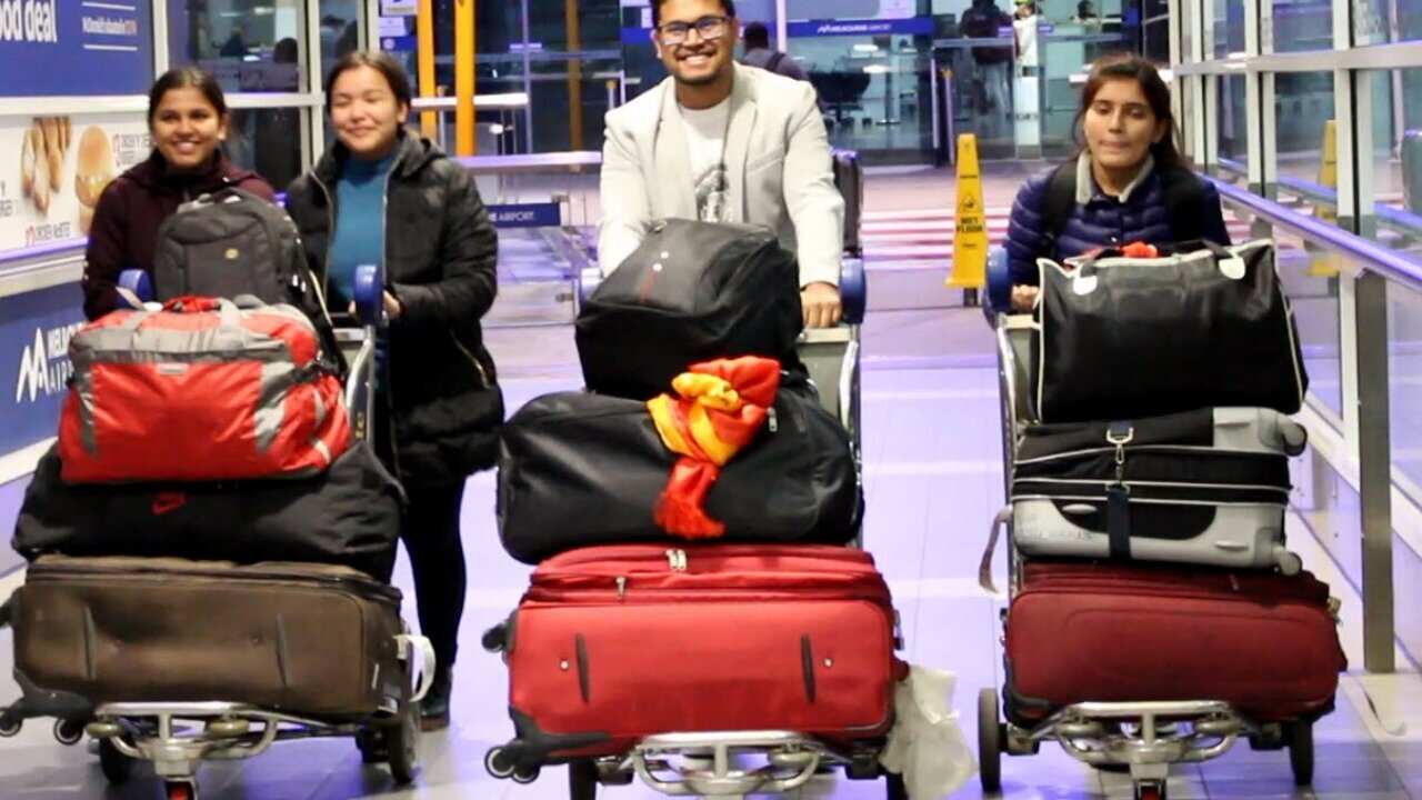Saroj Khanal with fellow international students from Nepal at Melbourne International airport.