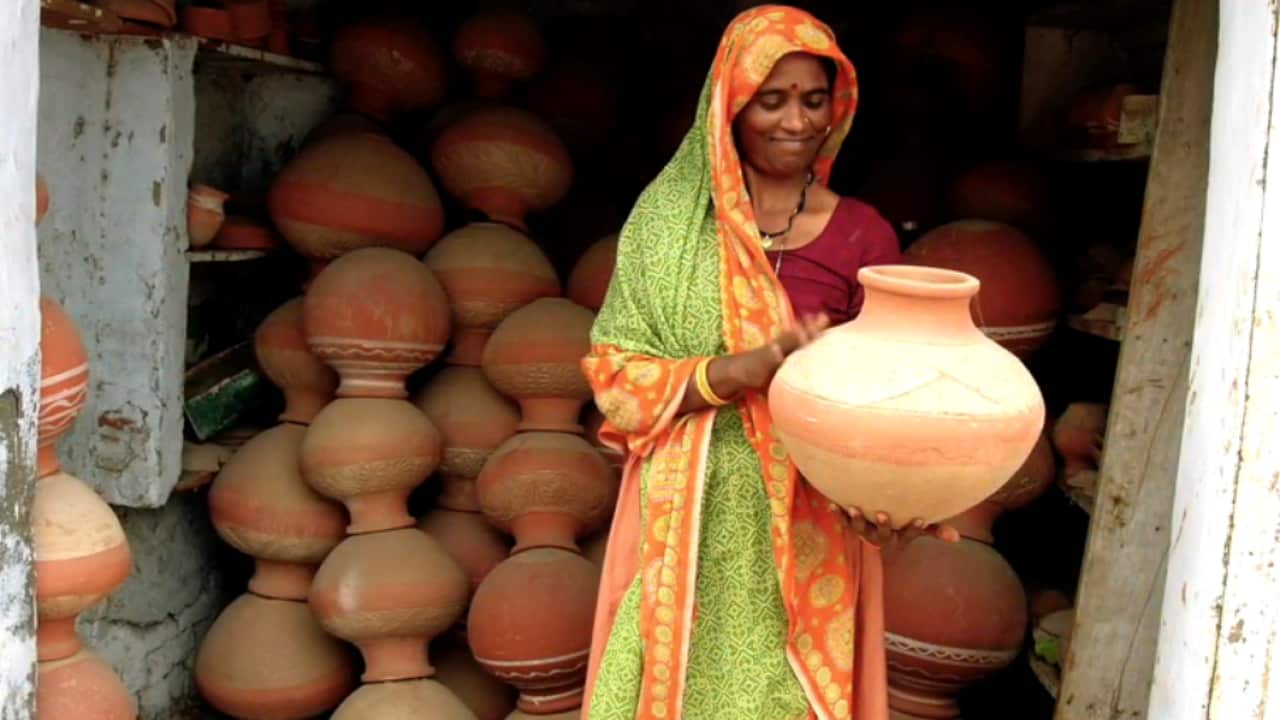 Indian woman holding pot