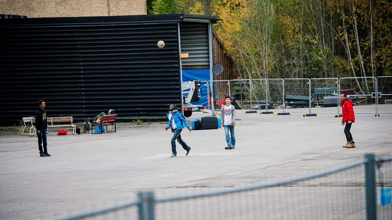 Refugee's play football outside their shelter in Sundbyberg, north-west of Stockholm