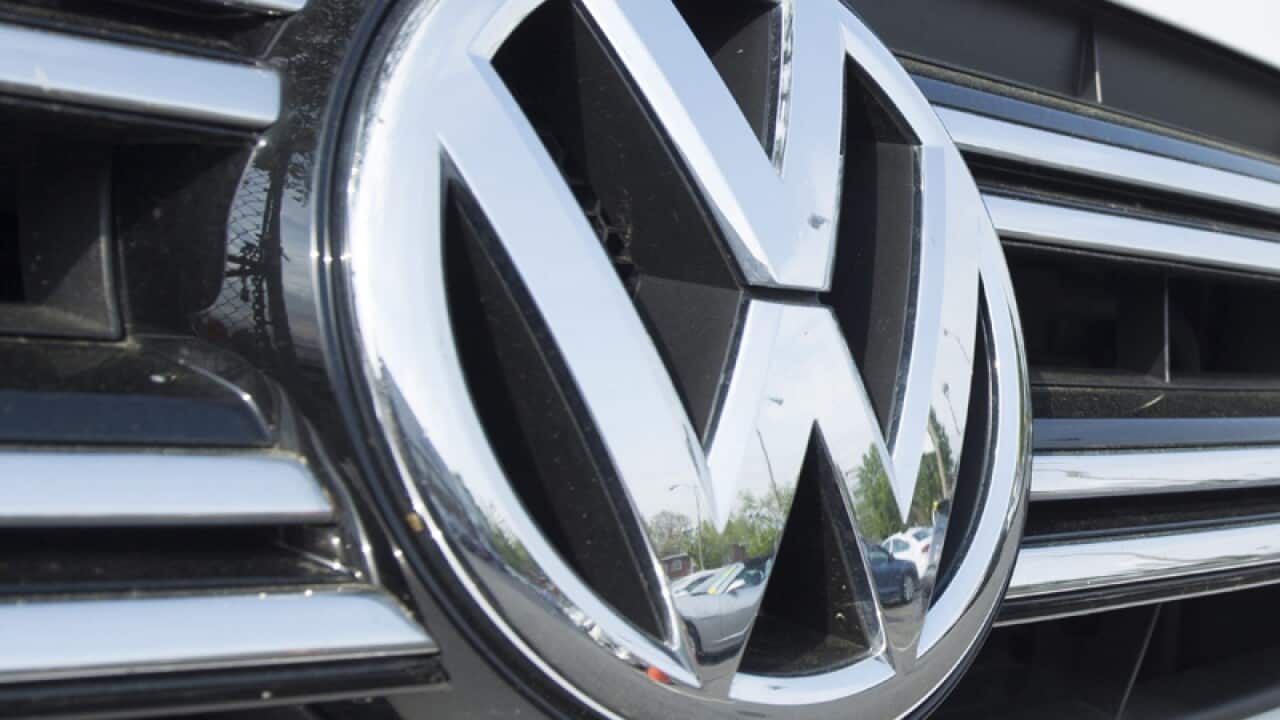 A Volkswagen badge on a car.
