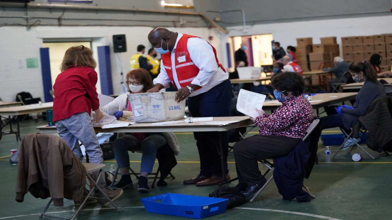 Election officials in Wisconsin and Georgia, said recounts in those states were very unlikely to reverse Donald Trump's losses.