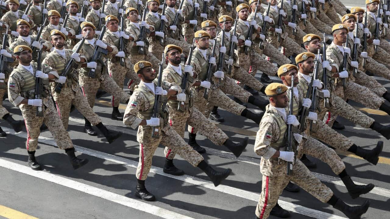 Iranian army troops march at a military parade marking 39th anniversary of outset of Iran-Iraq war.