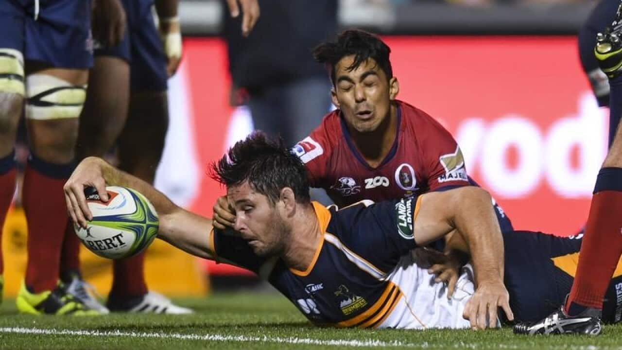 Sam Carter of the Brumbies scores a try.