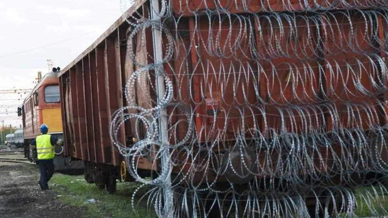 Razor wire is installed on a train wagon to be used as the border closure between Hungary and Croatia at the railway station in Zakany, 230 kms southwest of Budapest