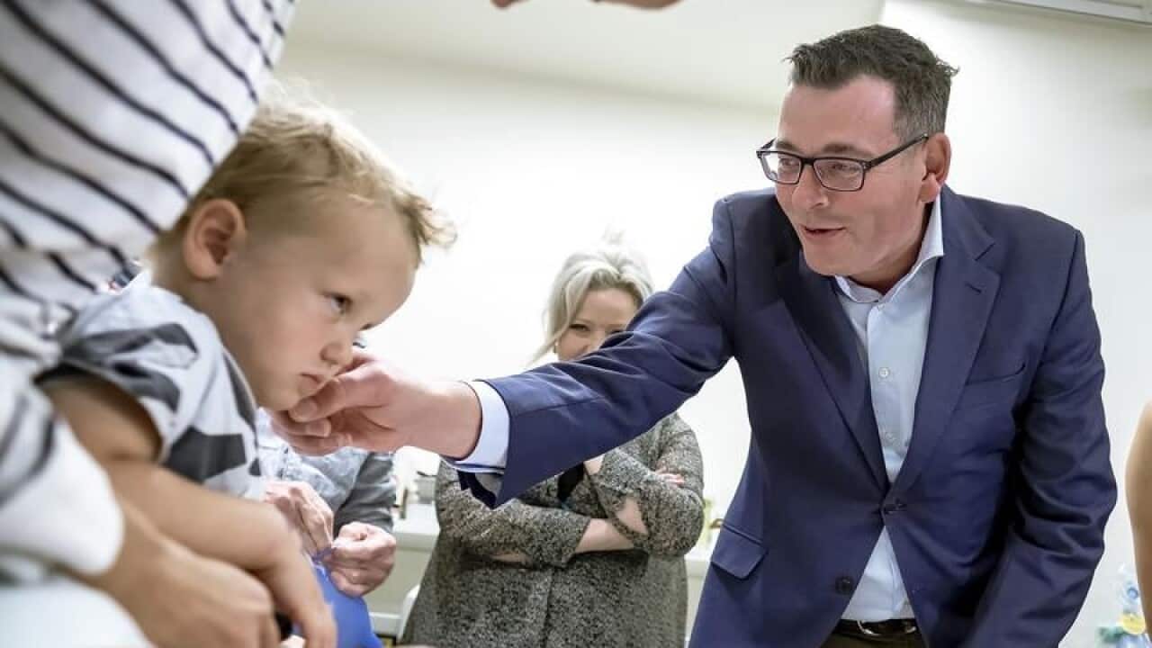 Victorian Premier Daniel Andrews with a child patient in hospital.