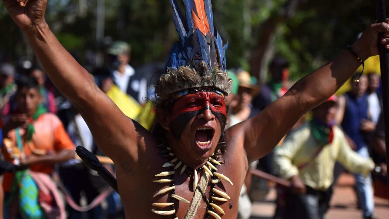 A indigenous Colombian man shouts slogans during the march for the Pan America way in Columbia.