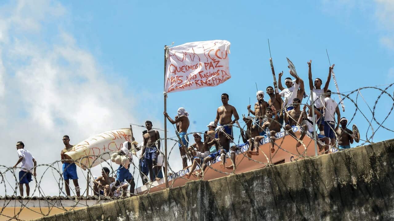 A group of inmates stand on a roof inside the State Penitentiary of Alcacuz in Nisia Floresta near Natal, Rio Grande do Norte, Brazil in January 2017.