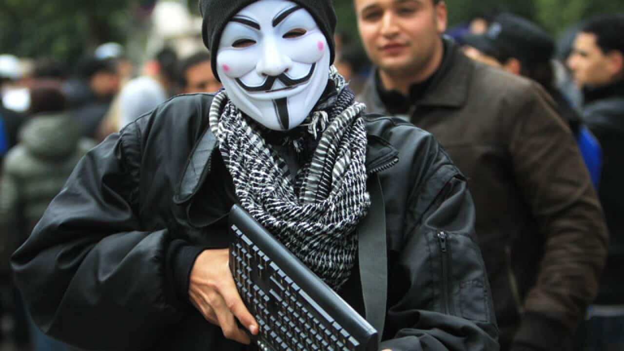 An 'Anonymous' influenced protester takes to the streets of Tunis. The Islamist party dominating Tunisia's ruling coalition last week rejected its own prime minister's decision to form a non-partisan technocratic government to try to appease critics, sign