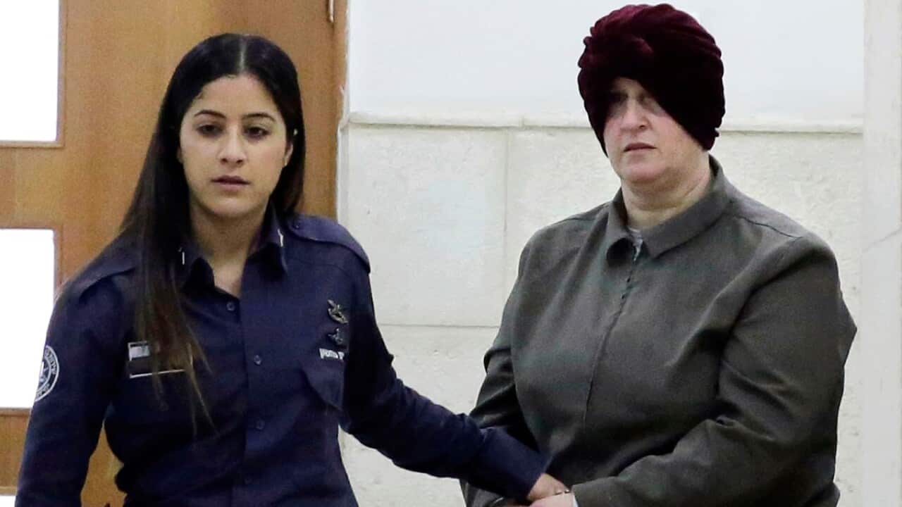 Israeli-born Australian Malka Leifer, right, is brought to a courtroom in Jerusalem